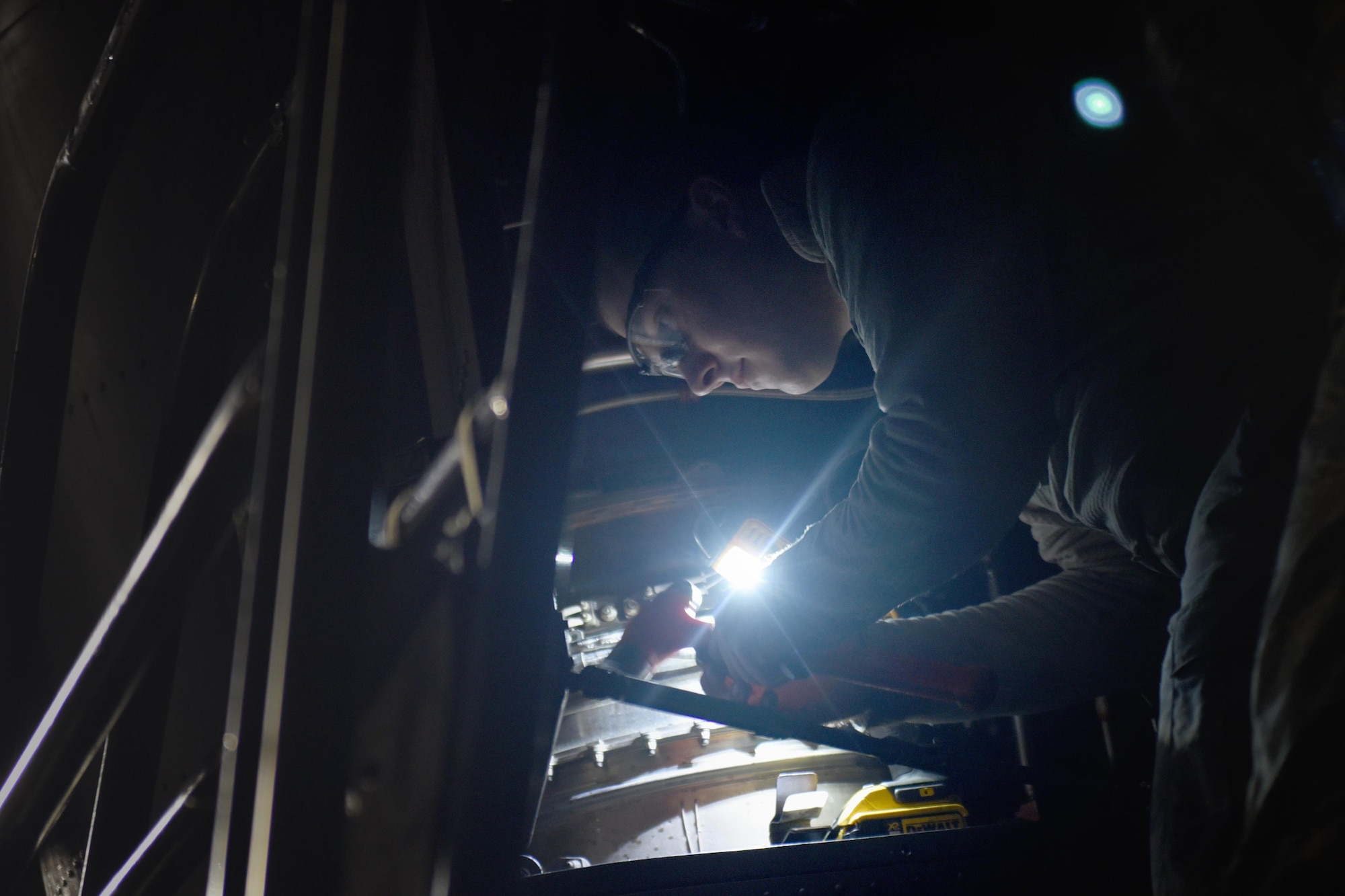 An Air Commando with the 27th Special Operations Maintenance Squadron’s Aircraft Structural Maintenance shop repairs a CV-22 Osprey tilt-rotor aircraft November 16, 2016 at Cannon Air Force Base, N.M. Aircraft structural maintainers are part of a large group of Cannon Air Commandos who work through the night to keep aircraft flying. (U.S. Air Force Photo by Senior Airman Shelby Kay-Fantozzi/released) 