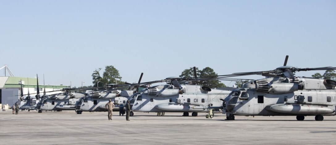 Several CH-53E Super Stallion helicopters from Marine Heavy Helicopter Squadron 772, Special Purpose Marine Air-Ground Task Force - Southern Command, standby on the flight line aboard Marine Corps Air Station New River, North Carolina, before departing for Soto Cano Air Base, Honduras, June 8, 2016. SPMAGTF-SC is a temporary deployment of Marines and sailors throughout Honduras, El Salvador, Guatemala, and Belize with a focus on building and maintaining partnership capacity with each country through shared values, challenges, and responsibility. (U.S. Marine Corps photo by Sgt. Adwin Esters/Released) 