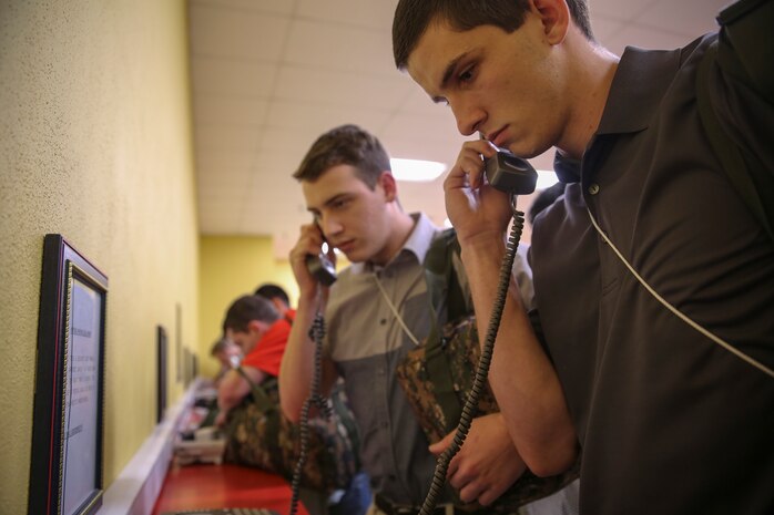Recruits from Alpha Company, 1st Recruit Training Battalion, make their phone calls home, reading only what is printed on the script in front of them, during receiving at Marine Corps Recruit Depot San Diego, Jan. 9. Recruits will not be able to make another phone call until the end of recruit training. Annually, more than 17,000 males recruited from the Western Recruiting Region are trained at MCRD San Diego. Alpha Company is scheduled to graduate April 7.
