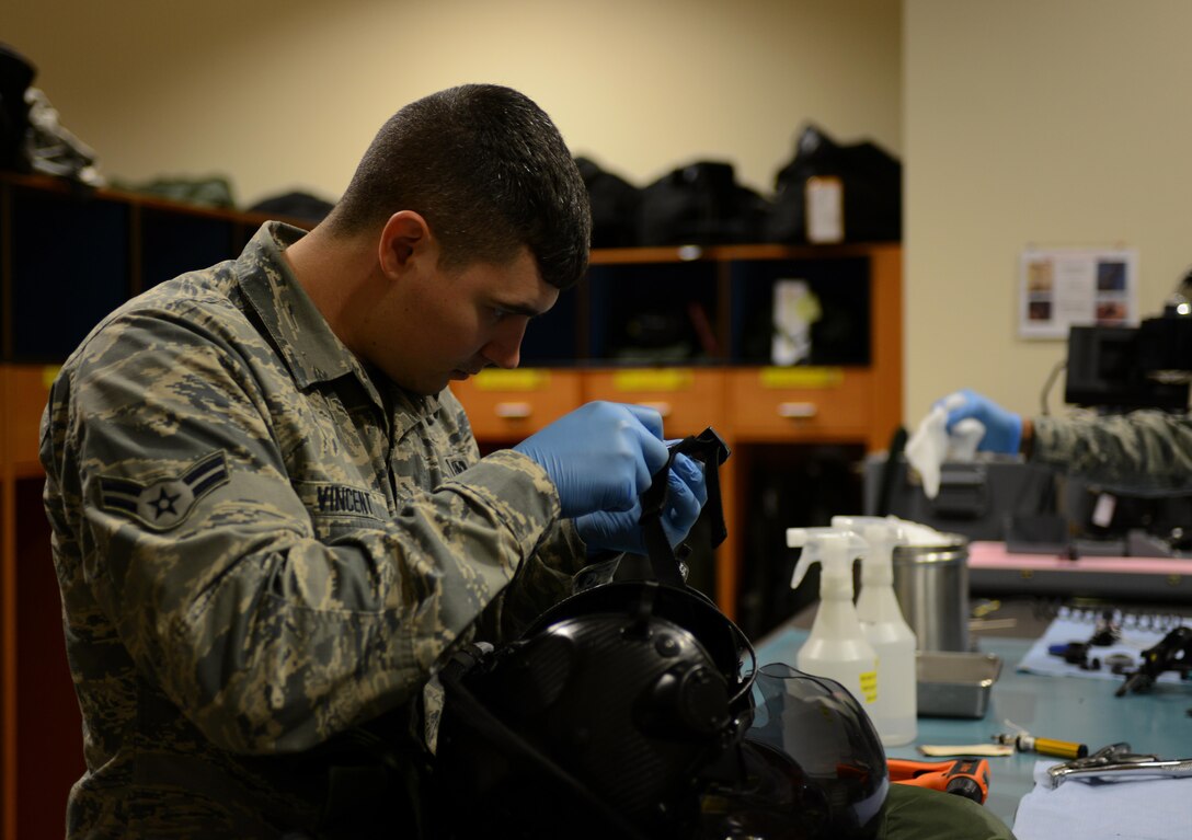 Airman 1st Class Jake Vincent, 56th Operations Support Squadron aircrew flight equipment journeyman, performs preventative maintenance on a Generation II F-35 Lightning II helmet, Dec. 1, 2016, at Luke Air Force Base, Ariz. Checking and cleaning flight equipment is a requirement for the 30-day inspection process. (U.S. Air Force photo by Airman 1st Class Alexander Cook)