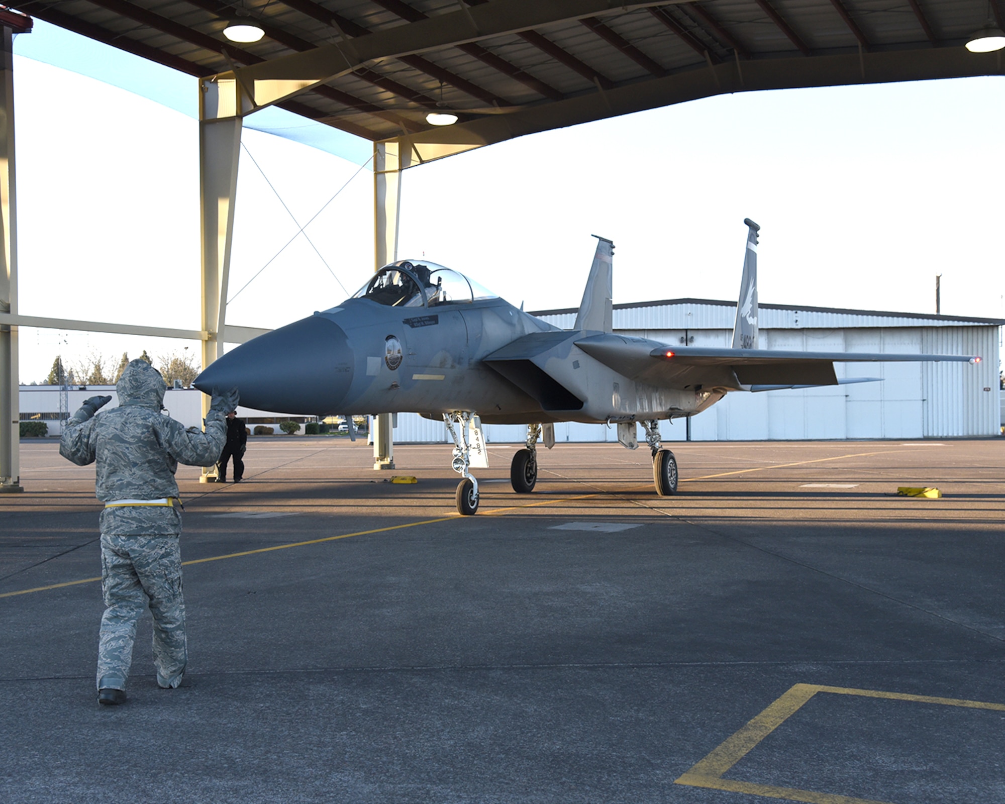 Crew Chief, Master Sgt. Mark Billmyer, 142nd Aircraft Maintenance Squadron, marshals F-15C Eagle 78-482 for its first launch with a new wing, Portland Air National Guard Base, Ore., Jan. 3, 2017. (U.S. Air National Guard photo by Senior Master Sgt. Shelly Davison, 142nd Fighter Wing Public Affairs)

