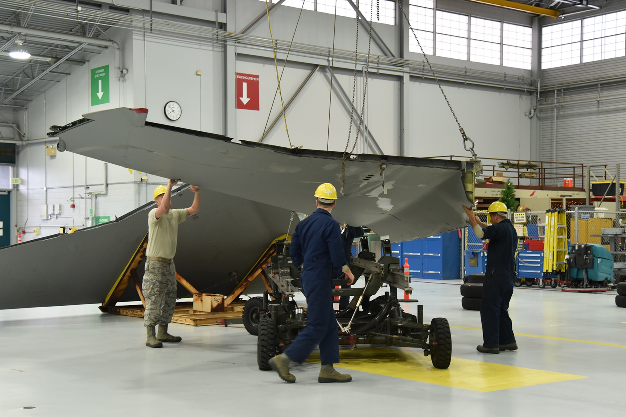 The Depot Field Team from the 402nd Aircraft Maintenance Group, Robins Air Force Base, Ga., removes the old wing from an F-15C Eagle assigned to the 142nd Fighter Wing, Portland Air National Guard Base, Ore., Dec. 6, 2016. (U.S. Air National Guard photo by Senior Master Sgt. Shelly Davison, 142nd Fighter Wing Public Affairs)