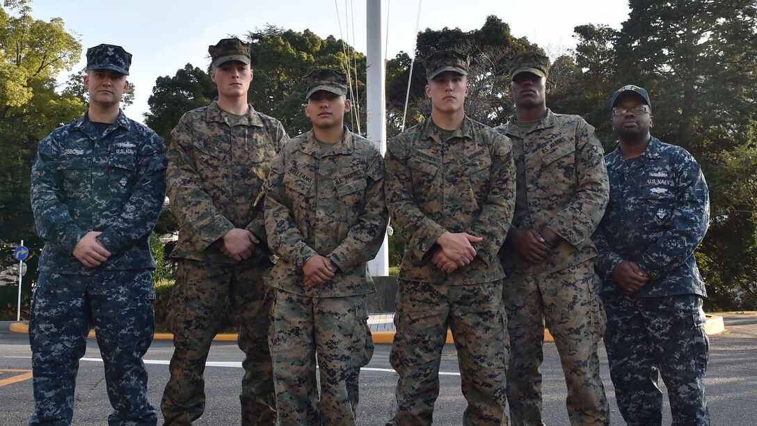 Four U.S. Marines and two Sailors instinctively responded alongside local residents when a vehicle with five passengers fell from the fifth story of a parking garage in Yokosuka, Dec. 31, 2016. Once the Marines arrived on scene, the group collectively flipped the car in order to remove the passengers prior to Japanese Emergency Medical Services arriving. The Marines are assigned to 3rd Battalion, 1st Marine Regiment and forward deployed to 3rd Marine Division, III Marine Expeditionary Force based in Okinawa, Japan. The Sailors are assigned to Commander Fleet Activities Yokosuka. Pictured left to right: Petty Officer 1st Class Garrett Osborne, Lance Cpl. James Flores, Lance Cpl. Manaure Arellano, Pfc. Jacob Boerner, Lance Cpl. Raheem Gilliam and Petty Officer 2nd Class Derhon Finch.