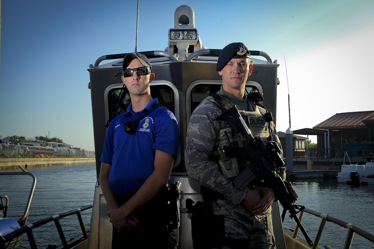 Senior Airmen Zade Becker, left, a marine patrolman assigned to the 6th Security Forces Squadron (SFS), and his brother Austin Becker, right, an emergency services team operator assigned to the 6th SFS, pause for a photo at MacDill Air Force Base, Fla., Dec. 14, 2016. The Becker brothers are currently stationed together at MacDill and defend the base as security forces members. (U.S. Air Force photo by Airman 1st Class by Mariette Adams)