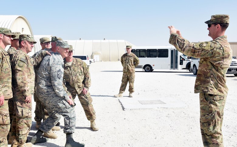 U.S. Air Force Command Chief Master Sgt. Ronald Anderson, Air National Guard command chief, poses for a group photo with members of the 577th Expeditionary Prime BEEF Squadron at Al Udeid Air Base, Qatar, Jan. 4, 2016. Anderson visited with guardsmen deployed to Al Udeid alongside U.S. Air Force Lt. Gen. L. Scott Rice, Air National Guard director. (U.S. Air Force photo by Senior Airman Cynthia A. Innocenti)