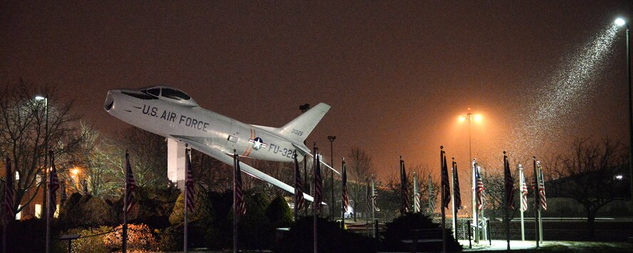 Snow falls around the F-86 Sabre static display during a winter storm that hit the base and region last weekend. The local community saw more than nine inches of snow in the past week from winter storms. (US Air Force Photo by Linda LaBonte Britt)  
