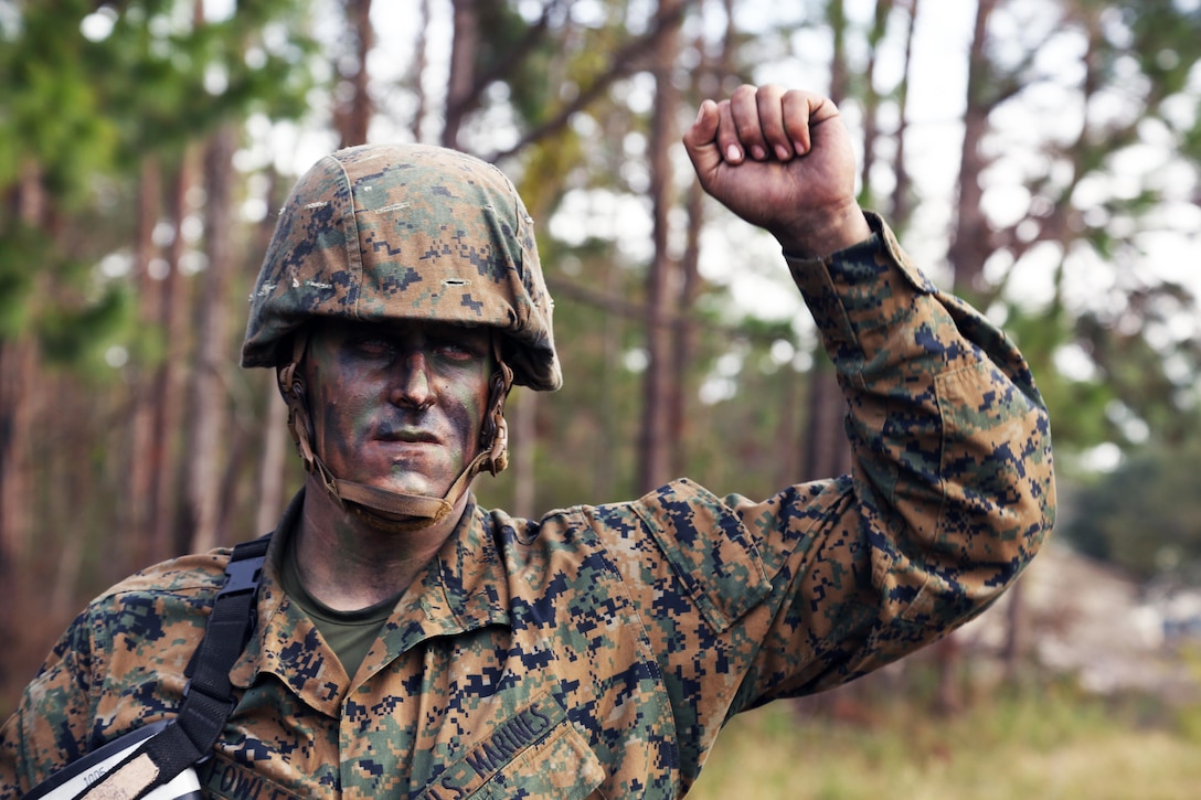 Marine Corps recruit Owen Fowler practices hand and arm signals at the beginning of Basic Warrior Training at Paige Field on Marine Corps Recruit Depot, Parris Island, S.C., Jan. 4, 2017. Basic Warrior Training is a 48 hour training evolution that covers land navigation, improvised explosive devices and fire and movement. Fowler is assigned to Platoon 1005, Company C, 1st Battalion, Recruit Training Regiment. Marine Corps photo by Lance Cpl. Sarah Stegall
