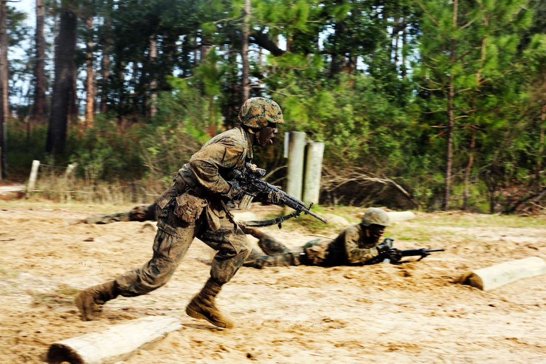 A Marine Corps recruit rushes forward during Basic Warrior Training at Paige Field on Marine Corps Recruit Depot, Parris Island, S.C., Jan. 4, 2017. Basic Warrior Training is a 48 hour training evolution that covers land navigation, improvised explosive devices and fire and movement. Marine Corps photo by Lance Cpl. Sarah Stegall