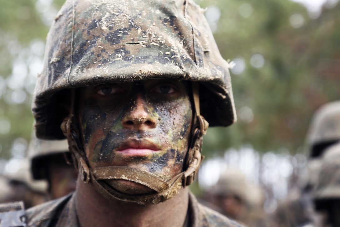 A Marine recruit stands in formation during Basic Warrior Training at Paige Field on Marine Corps Recruit Depot, Parris Island, S.C., Jan. 4, 2017. Basic Warrior Training is a 48 hour training evolution that covers land navigation, improvised explosive devices and fire and movement. The recruit is assigned to Platoon 1004, Company C, 1st Battalion, Recruit Training Regiment. Marine Corps photo by Lance Cpl. Sarah Stegall