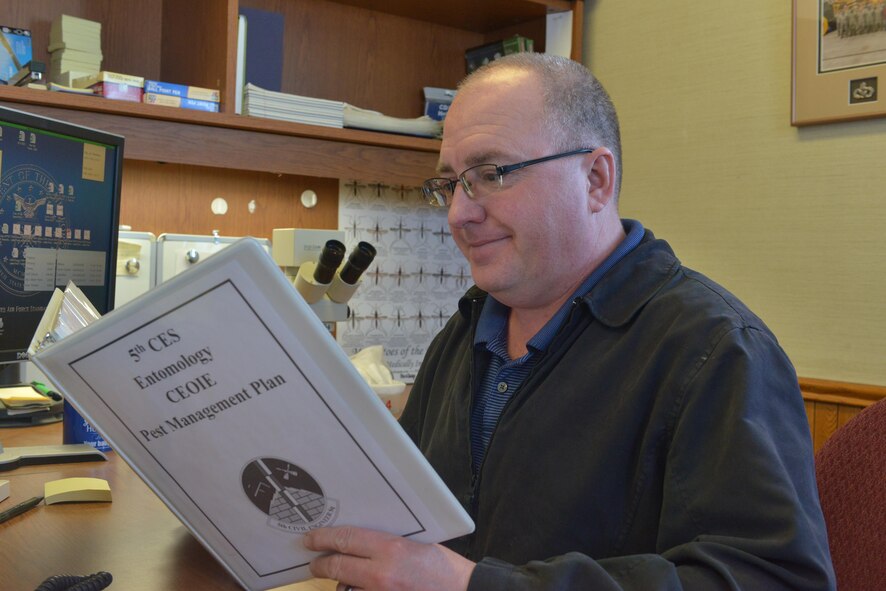 Lester Nicholas, 5th Civil Engineer Squadron pest management foreman, looks over a pest management plan at Minot Air Force Base, N.D., Jan. 10, 2017. The Minot AFB entomology shop is responsible for preventative pest management year-round for both the 5th Bomb Wing and 91st Missile Wing. (U.S. Air Force photo/Airman 1st Class Jessica Weissman)