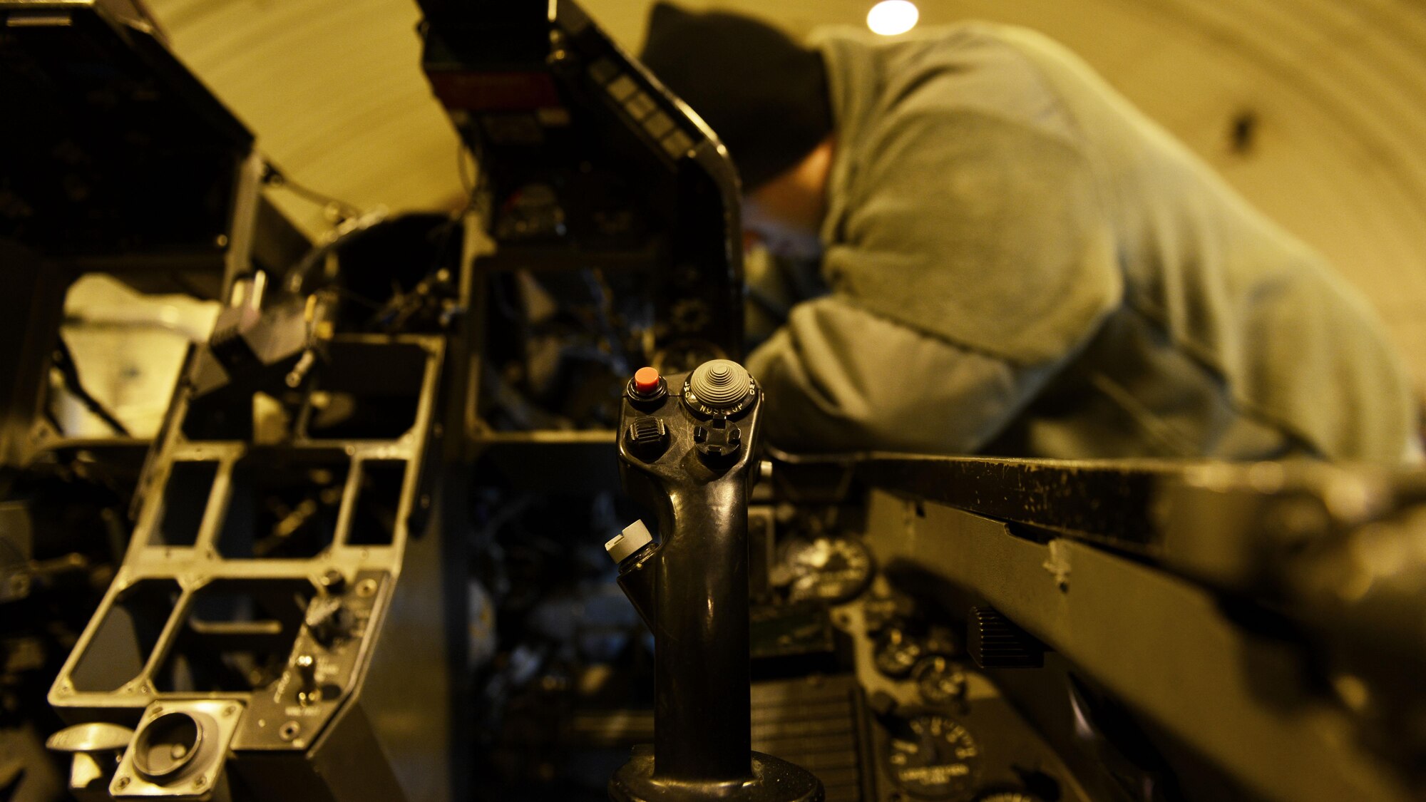 Senior Airman Glen Ratliff, 31st Maintenance Squadron Aircrew Egress Systems journeyman, installs a detonating transfer assembly line in an F-16 Fighting Falcon at Aviano Air Base, Italy recently. A full ejection seat removal, inspection and installation can take up to three days without replacing any parts. (U.S. Air Force photo by Senior Airman Cary Smith)