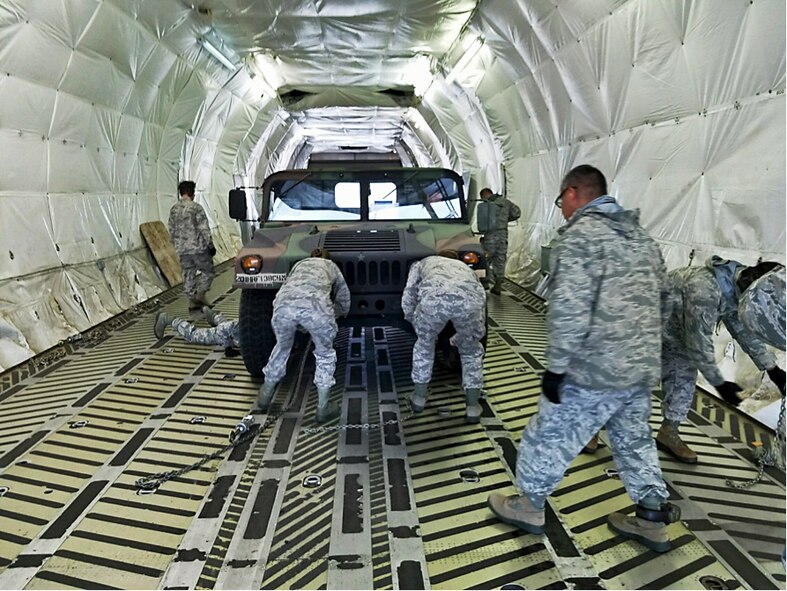 A group of 19 Aerial Port personnel from the 38th Aerial Port Squadron board a C-17 on cool brisk morning at Joint Base Charleston, South Carolina. The destination is a short flight to Dobbins Air Reserve Base, home of the Air Transportation Proficiency Center and Deployment Readiness Training. The ATPC’s goal is to train Reserve Airman in the Air Transportation career field to be proficient in their career field. (Courtesy photo)
