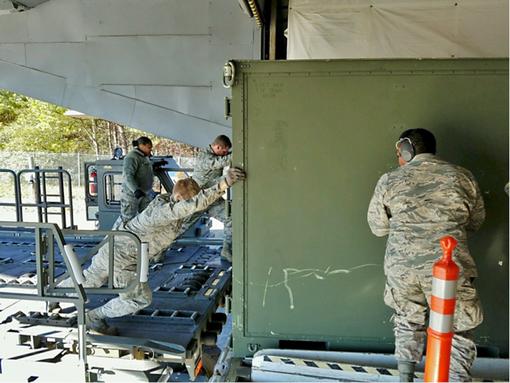 A group of 19 Aerial Port personnel from the 38th Aerial Port Squadron board a C-17 on cool brisk morning at Joint Base Charleston, South Carolina. The destination is a short flight to Dobbins Air Reserve Base, home of the Air Transportation Proficiency Center and Deployment Readiness Training. The ATPC’s goal is to train Reserve Airman in the Air Transportation career field to be proficient in their career field. (Courtesy photo)