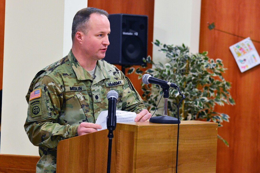 Army Lt. Col. Brett M. Medlin, battalion commander of U.S. Army Africa, addresses the audience at the Dr. Martin Luther King Jr. observance at Caserma Ederle, Vicenza, Italy, Jan. 10, 2017. Army photo by Paolo Bovo