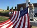 Staff Sgt. Jonathan Balko, an electrical and environmental craftsman assigned to the 28th Aircraft Maintenance Squadron, left, prepares to fly his American flag at Fort McHenry during a family vacation. From a young age, Balko knew he wanted to have a career related to military aviation. (Courtesy photo)