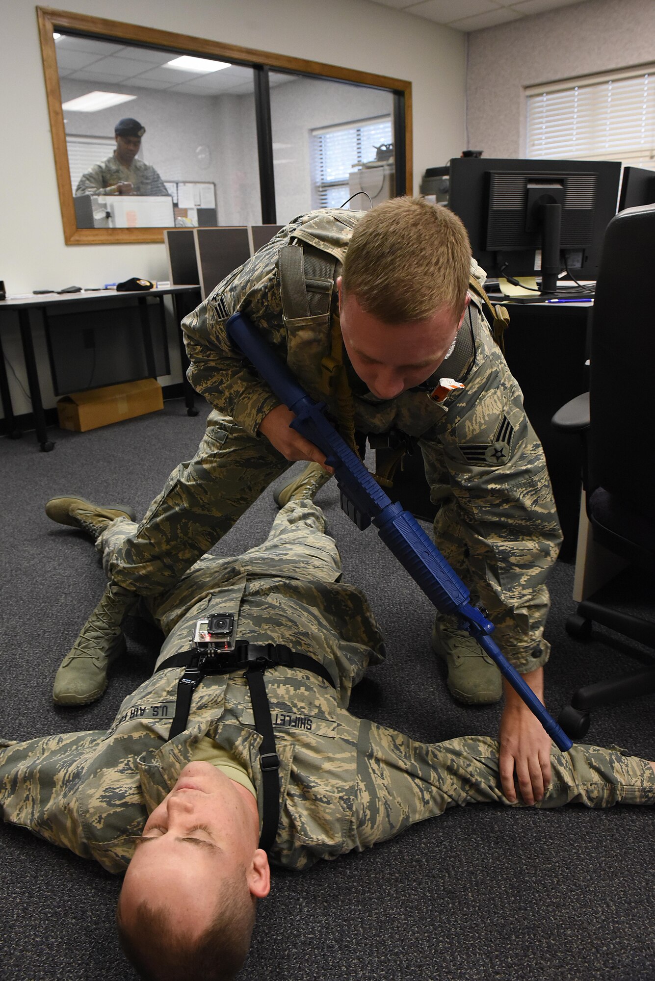 Senior Airman James Bugaj, 4th Security Forces Squadron patrolman, apprehends an “active shooter” during a planned exercise, Jan. 11, 2017, at Seymour Johnson Air Force Base, North Carolina. The 4th Fighter Wing designs realistic exercises to keep Airmen in a warrior mindset and sharpen tactics, techniques and procedures to prevent unnecessary loss of life and injuries in the event of a real-world incident. (U.S. Air Force photo by Airman 1st Class Kenneth Boyton)