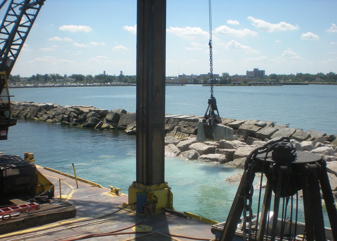 The U.S. Army Corps of Engineers completed a series of breakwater repair projects along Lake Erie in late 2016. The breakwaters were damaged by Superstorm Sandy. The photo shows repair work being done in Lorain Harbor.