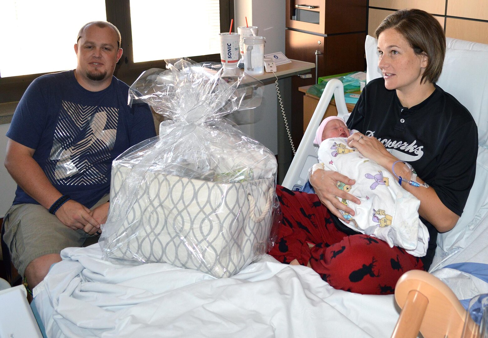 U.S. Army Sgt. Tiffany Curtis, 7210 Medical Support Unit, Fort Sam Houston, Texas, and husband Justin Curtis, are the proud parents of the first baby born at Brooke Army Medical Center, Jan. 1, 2017. Lexy Curtis was born at 7:22 a.m., weighing 6 pounds, 13 ounces and 20 1/2 inches long. (U.S. Army photo by Robert A. Whetstone/Released)
