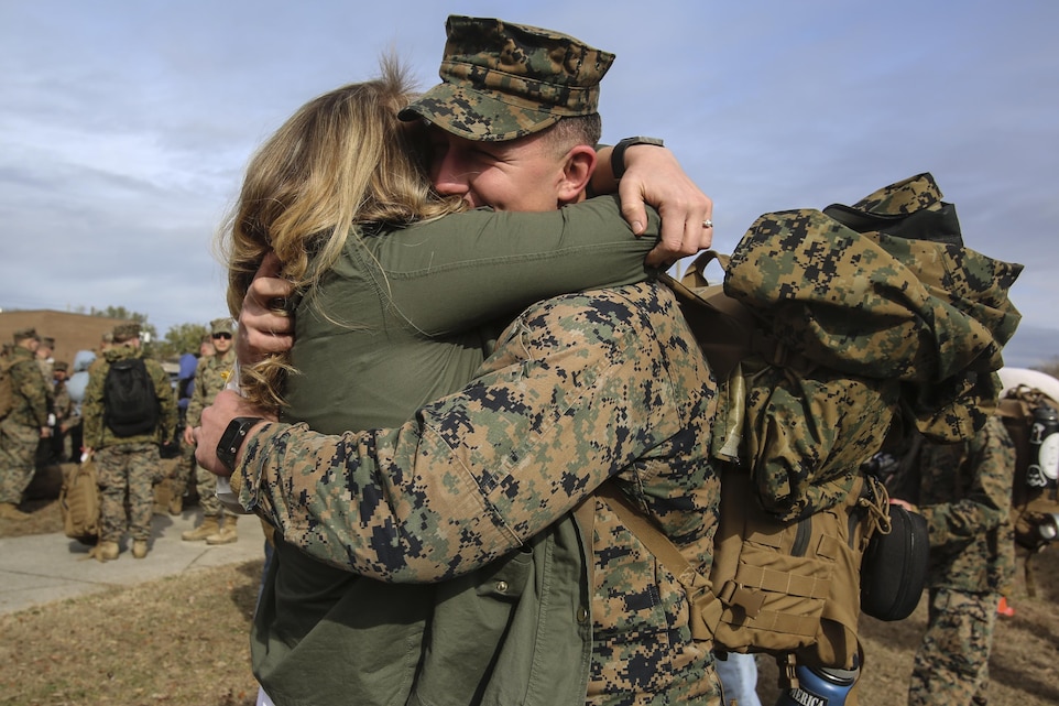A Marine embraces a loved one during Special Purpose Marine Air-Ground Task Force Crisis Response-Africa’s homecoming at Camp Lejeune, N.C., Jan. 10, 2017. After completing the mission of protecting U.S. personnel, property and interests in Europe and Africa, Marines returned home safely from their nine-month deployment. The Marines and sailors returning are with Combat Logistic Battalion 2 (U.S. Marine Corps photo by Lance Cpl. Miranda Faughn)