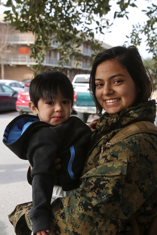 Lance Cpl. Priscilla Lopez and son Hector are reunited at Camp Lejeune, N.C., Jan. 10, 2017 after a nine-month deployment with Special Purpose Marine Air-Ground Task Force Crisis Response-Africa. The SPMAGTF-CR-AF goal is to protect U.S. personnel, property and interests in Europe and Africa. Lopez is a food service specialist with Combat Logistic Battalion 2. (U.S. Marine Corps photo by Lance Cpl. Miranda Faughn)