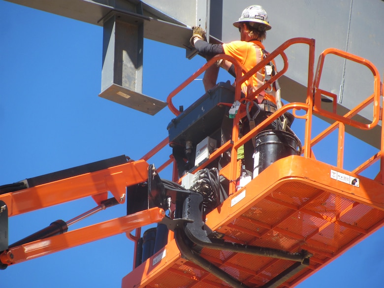 Workers on the newly unveiled Unmanned Aerial Systems hangar constructed at Camp Mackall near Fort Bragg, North Carolina. The facility, built by Caddell Construction, won the state and national-level Associated Builders and Constractors, Inc. Excellence in Construction Competition in December 2016. It also received state-level honors from the Associated General Contractors of America.