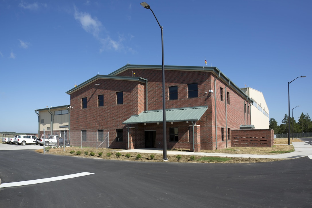 A photo of the Unmanned Aerial Systems hangar constructed at Camp Mackall near Fort Bragg, North Carolina. The facility, built by Caddell Construction, won the state and national-level Associated Builders and Constractors, Inc. Excellence in Construction Competition in December 2016. It also received state-level honors from the Associated General Contractors of America. It will be home to the UAS MQ-1C Gray Eagle and feature operations and maintenance hangar with shops and supply, company administration and supply space, tool and parts storage, 5-ton bridge crane, oil water separator, oil and hazardous material storage, aircraft container storage, organizational vehicle parking, information systems, fire protection and alarm systems, intrusion detection installation and Energy Monitoring Control Systems (EMCS) connection. Work also included runway overlay, replace taxiway and shoulders, taxiway lighting, and access apron.