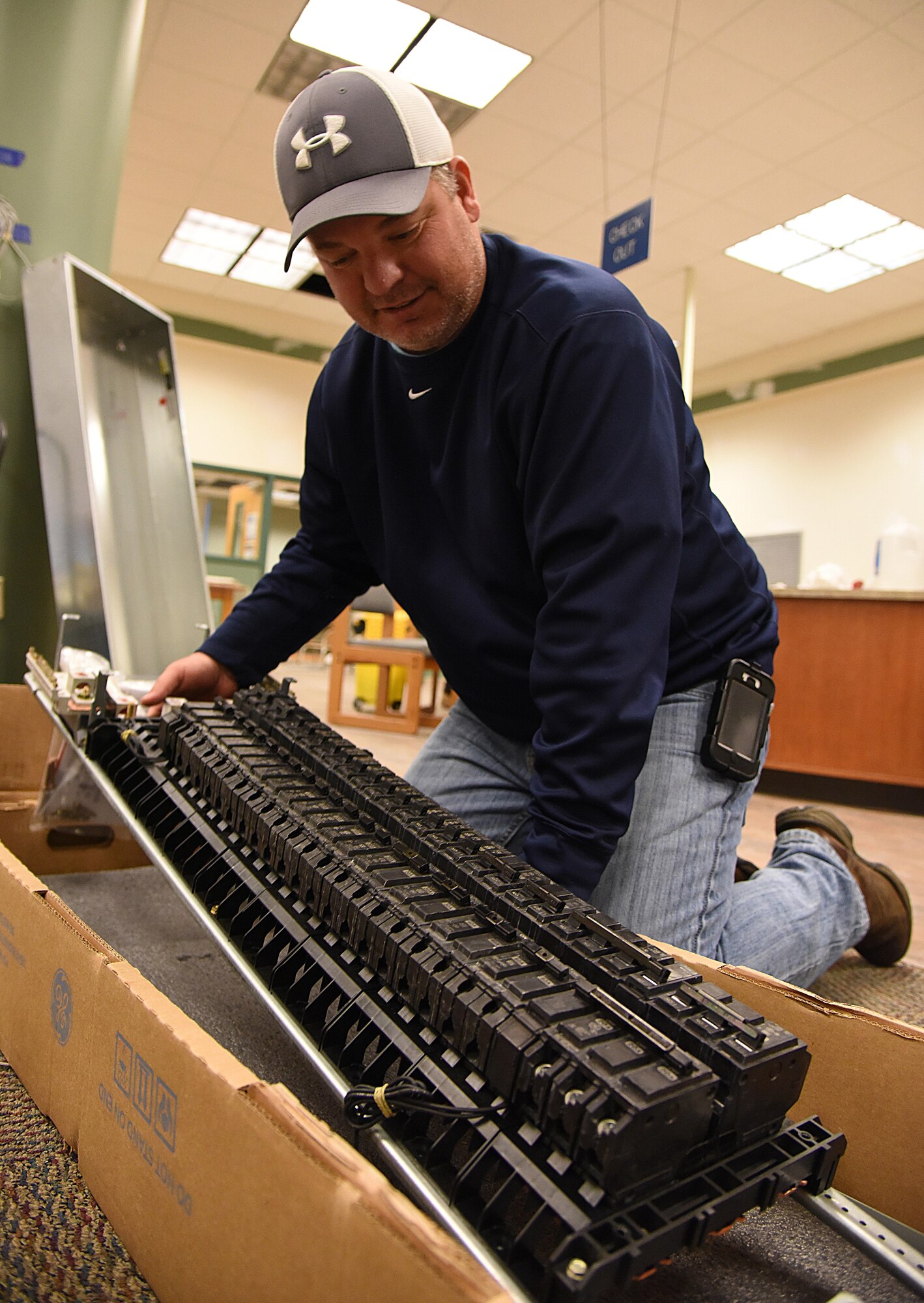 Glenn Anderson, DNP Inc. electrical superintendent, prepares an electrical panel for installation at the McBride Commons Jan. 6, 2017, on Keesler Air Force Base, Miss. The McBride Commons renovation project will transition the former base library into a common area which will include a children’s library, computer stations, engraving, framing, marketing and print shops and a full kitchen. The nine-month project is expected to be complete by May 2017. (U.S. Air Force photo by Kemberly Groue) 