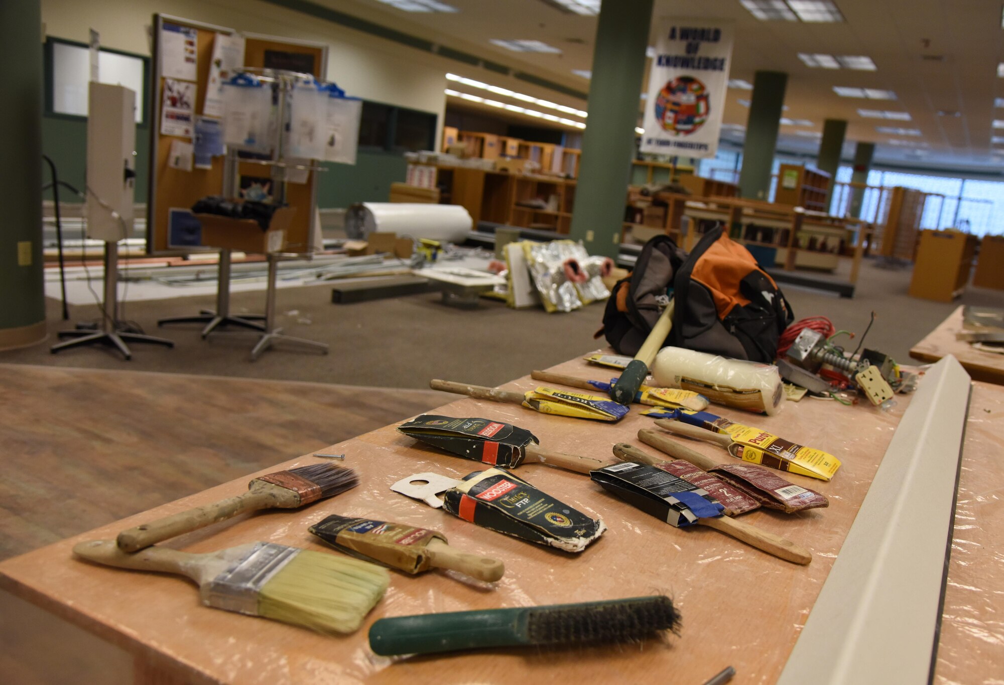 Painting tools sit on display at the McBride Commons Jan. 6, 2017, on Keesler Air Force Base, Miss. The McBride Commons renovation project will transition the former base library into a common area which will include a children’s library, computer stations, engraving, framing, marketing and print shops and a full kitchen. The nine-month project is expected to be complete by May 2017. (U.S. Air Force photo by Kemberly Groue) 