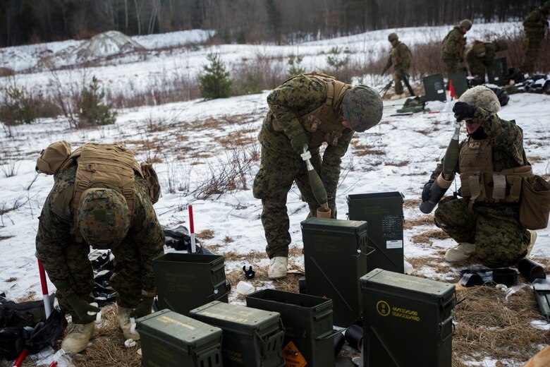 Marines with Weapons Company, 3rd Battalion, 25th Marine Regiment, 4th Marine Division, prepare 81mm mortar rounds for firing during exercise Nordic Frost at Camp Ethan Allen Training Site in Jericho, Vt., Jan. 7. 2017. Throughout the exercise, Marines conduct training in a demanding cold-weather environment that places an emphasis on small-unit leadership. (U.S. Marine Corps photo by Cpl. Melissa Martens/ Released)