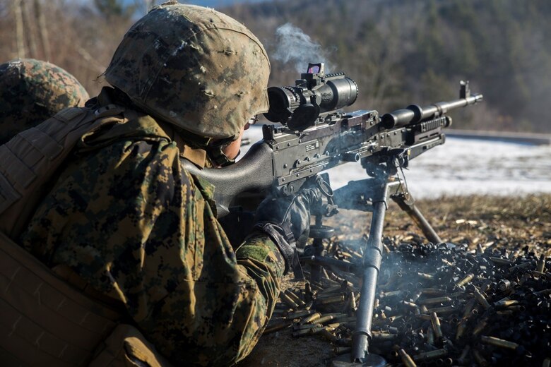 Lance Cpl. Jordan T. Woodard, machine gunner for Company I, 3rd Battalion, 25th Marine Regiment, 4th Marine Division, fires the M240 machine gun during exercise Nordic Frost at Camp Ethan Allen Training Site in Jericho, Vt., Jan. 7. 2017. Throughout the exercise, Marines conduct training in a demanding cold-weather environment that places an emphasis on small-unit leadership. (U.S. Marine Corps photo by Cpl. Melissa Martens/ Released)