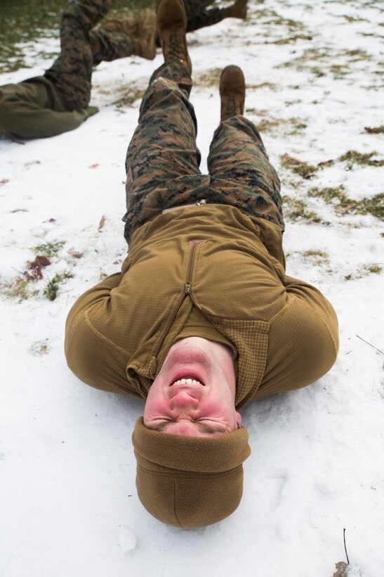 Lance Cpl. Michael F. Kinney, administration specialist, Headquarters and Service Company, 3rd Battalion, 25th Marine Regiment, 4th Marine Division, performs flutter kicks during a Marine Corps Martial Arts Program course while at exercise Nordic Frost at Camp Ethan Allen Training Site in Jericho, Vt., Jan. 8. 2017. Marines were provided the opportunity to obtain their grey or green belts during the exercise. (U.S. Marine Corps photo by Cpl. Melissa Martens/ Released) 