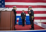 Capt. George B. Doyon, left, relieves Capt. Marvin E. Thompson as commander, Amphibious Squadron (PHIBRON) 11 during a change of command ceremony aboard amphibious assault ship USS Bonhomme Richard (LHD 6), Jan. 9, 2017. The ship is forward-deployed to Sasebo, Japan, providing rapid-response capability in the event of a regional contingency or natural disaster. 