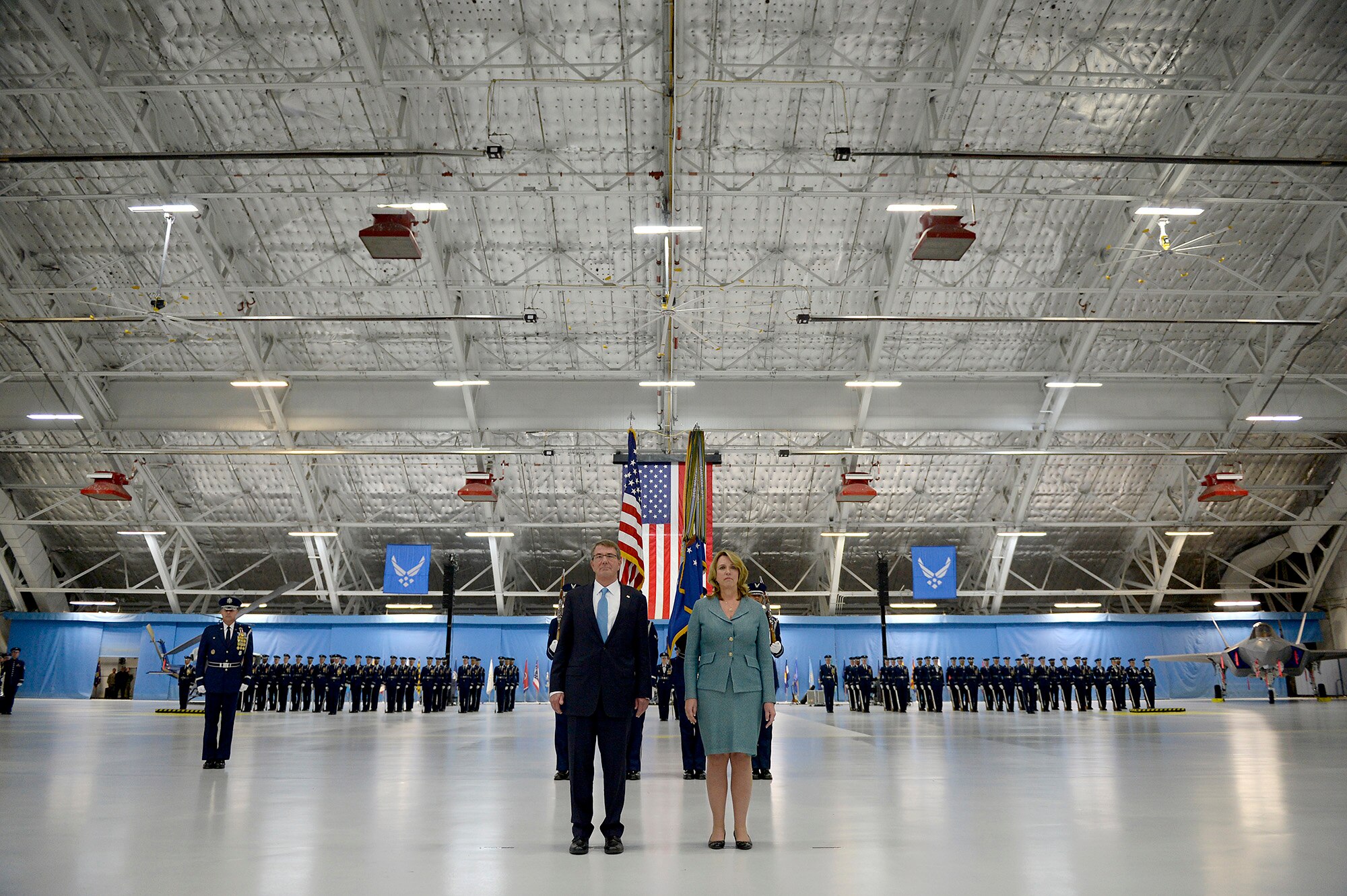 Secretary of Defense Ash Carter and Secretary of the Air Force Deborah Lee James listen to the citation for her Distinguished Public Service award during James' farewell ceremony at Joint Base Andrews, Md., Jan. 11, 2017.  James took office as the 23rd secretary of the Air Force in December 2013. (U.S. Air Force photo/Tech. Sgt. Joshua L. DeMotts)