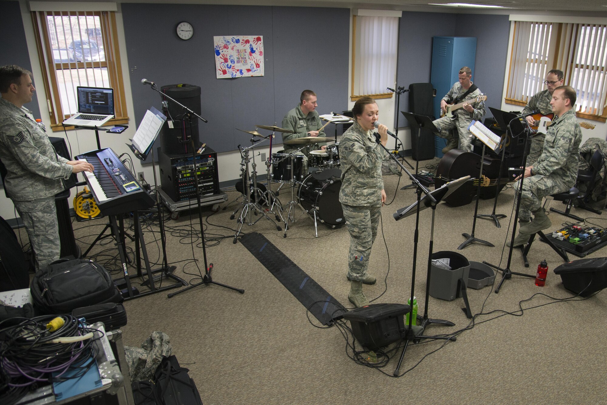 Members of Air Force Band of Mid-America Starlifter practice a variety of songs for Scott Air Force Base’s Centennial Celebration kick off, Jan. 4, 2017 at Scott Air Force Base, Ill.   Starlifter, is a seven-piece group of Airmen musicians. The group performs virtually every musical idiom, from rock and pop to jazz and country, to contemporary and traditional patriotic songs. (U.S. Air Force photo by Airman 1st Class Gwendalyn Smith)