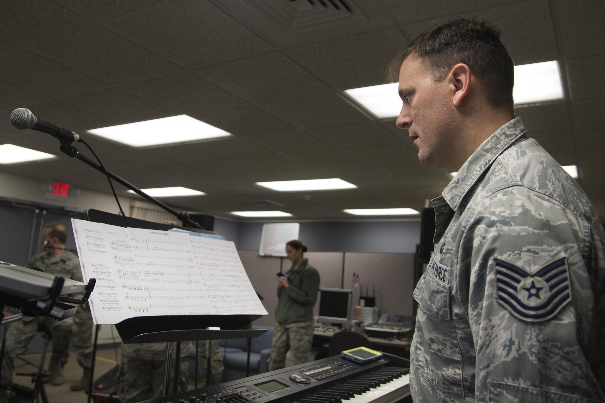 Tech. Sgt. Ryan Janus, Air Force Band of Mid-America Starlifter musician, practices the piano in preparation for Scott Air Force Base’s Centennial Celebration kick off, Jan. 4, 2017 at Scott Air Force Base, Ill. Starlifter is the musical ambassador of the Air Mobility Command. (U.S. Air Force photo by Airman 1st Class Gwendalyn Smith)