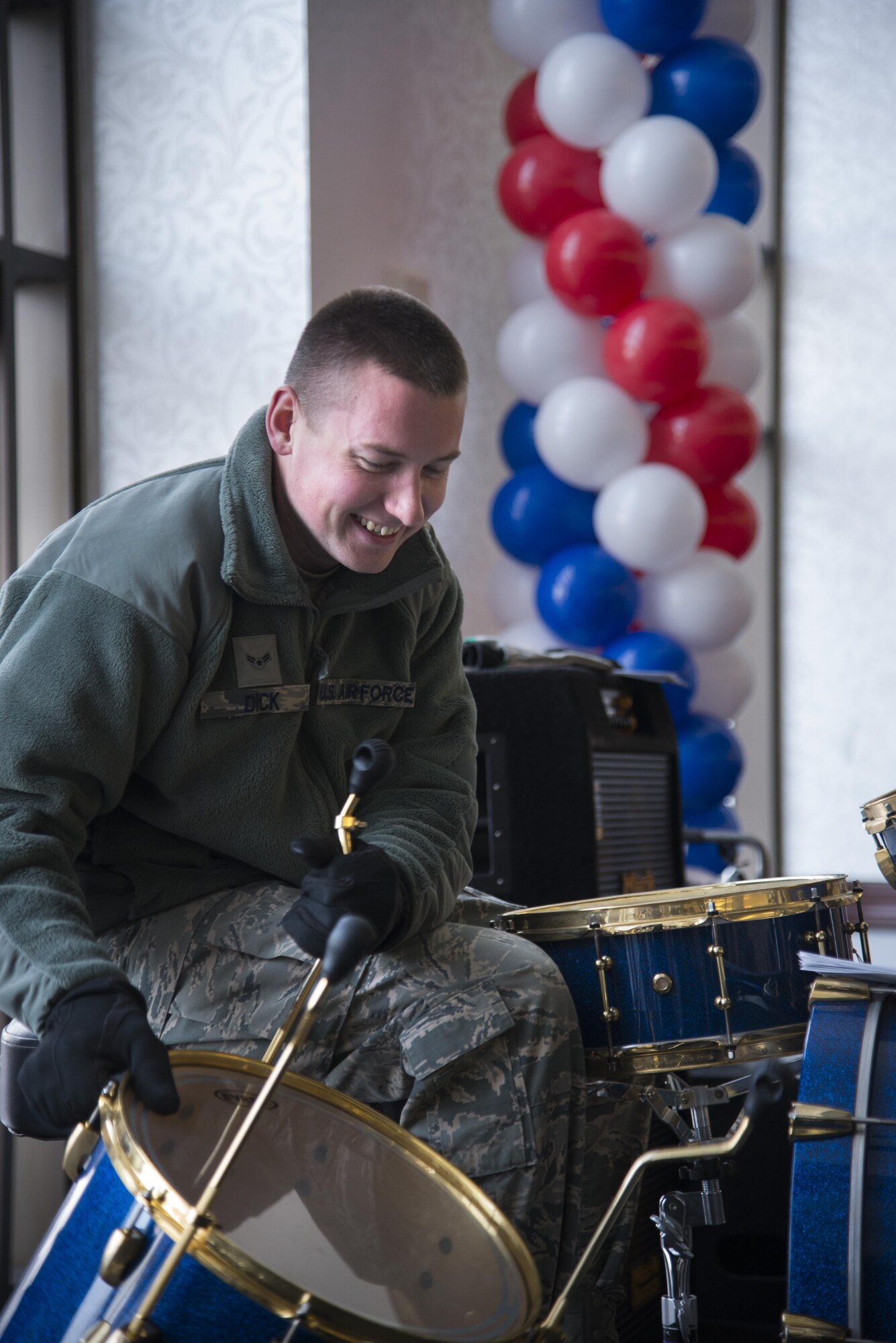 Airman 1st Class Joshua Dick, Air Force Band of Mid America Starlifter musician, assembles his drum set before the kick off of Scott Air Force Base’s 100th Celebration, Jan. 6, 2017. In addition to the installation’s 100th Birthday, Scott AFB also is acknowledging 2017 as the 30th Anniversary of U.S. Transportation Command, the 25th Anniversary as Air Mobility Command, and the Air Force’s 70th Anniversary. (U.S. Air Force photo by Airman 1st Class Gwendalyn Smith)