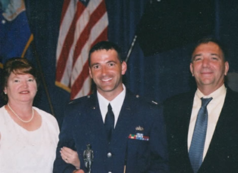 PETERSON AIR FORCE BASE, Colo. – Fred Brooks, now the 21st Civil Engineer Squadron installation management chief, poses for a photo with his mother Barb and step-father Earl during his Air Force commissioning.