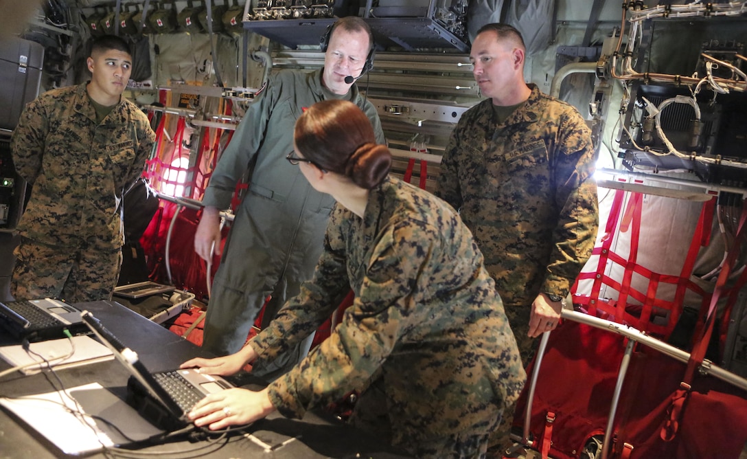 Master Sgt. Michael A. Moore, 3rd Marine Aircraft Wing G-6, technical control engineer, demonstrates the abilities of the Hatch Mounted SATCOM (Satellite Communication) Antenna System (HMSAS) to the commanding general of 3rd MAW, Maj. Gen. Mark Wise aboard Marine Corps Air Station Miramar, Calif., Jan. 9. The HMSAS was developed for pre-deployment training in order to enhance communications for raid force and tactical recovery of aircraft and personnel (TRAP) missions, in preparation to support a Special Purpose Marine Air-Ground Task Force (SPMAGTF).