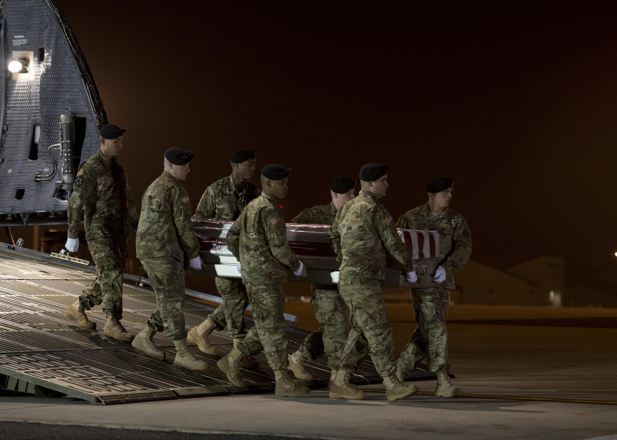 A U.S. Army carry team transfers the remains of Army Spc. Isiah L. Booker, of Cibolo, Texas, Jan. 11, 2017, during a dignified transfer at Dover Air Force Base, Del. Booker was assigned to the 2nd Battalion, 5th Special Forces Group, Fort Campbell, Ky. (U.S. Air Force photo by Senior Airman Zachary Cacicia)