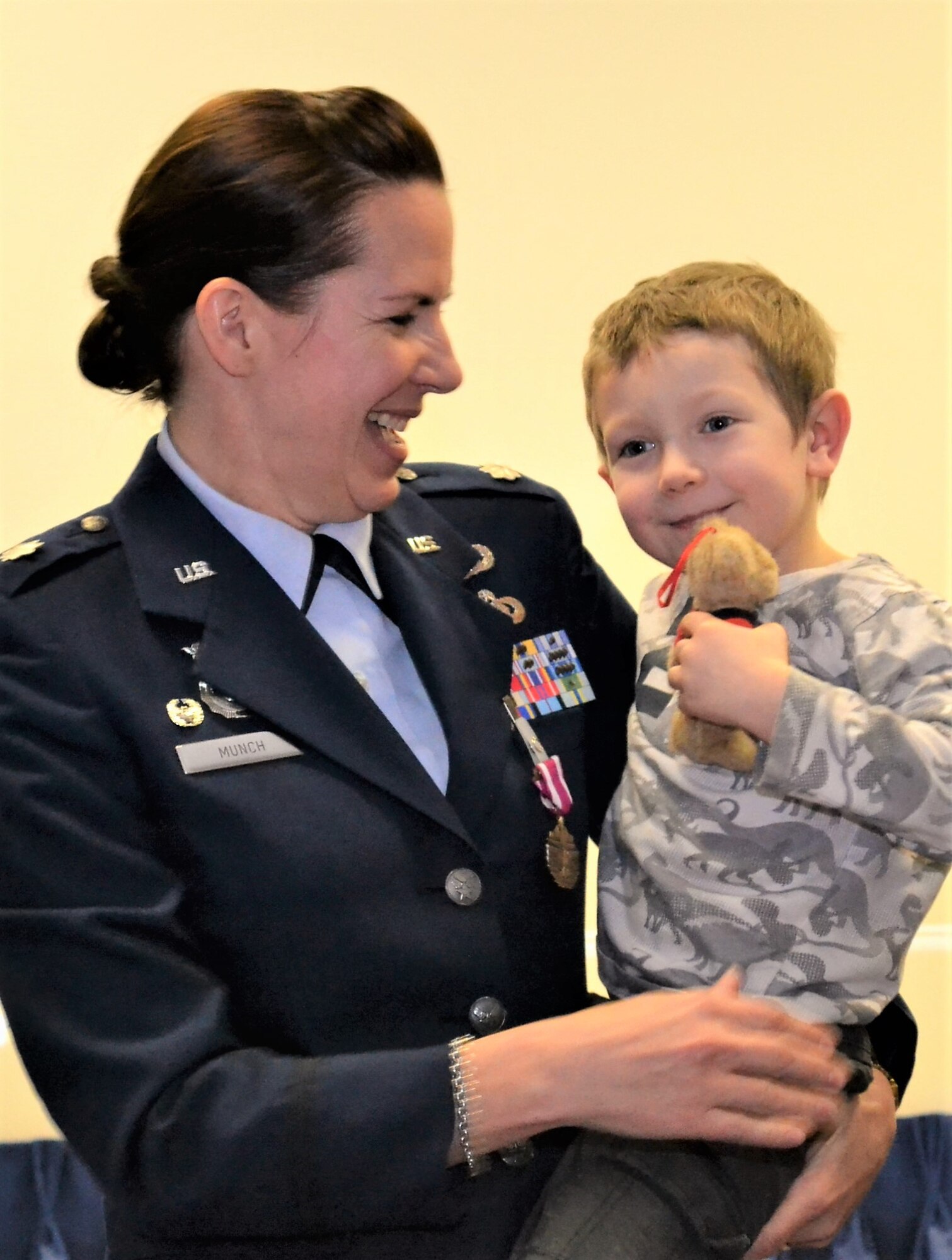 Lt. Col. Christine Munch, 111th Attack Wing inspector general, holds her grandson, James, during her change of command ceremony held at Horsham Air Guard Station, Pa., Jan. 8, 2017. Munch was formerly the commander of the 111th Security Forces Squadron and began her military career in 1985 as an enlisted security forces Airmen. (U.S. Air National Guard photo by Tech. Sgt. Andria Allmond/Released