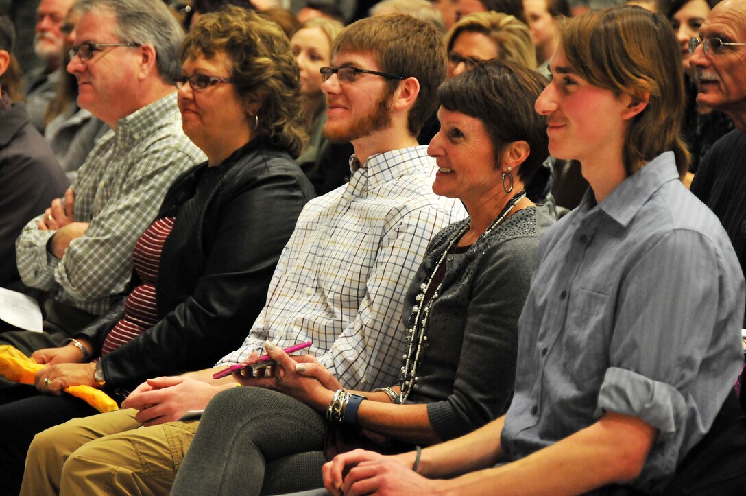 The family of Ret. Col. Chris Turner, former 190th Air Refueling Wing vice commander, watch in admiration as Turner speaks during his retirement ceremony Jan. 8, 2017, in the engine shop at Forbes Field, Kans. Turner had spent the past 20 years with the unit, two of which he served as the Wing’s vice commander. (U.S. Air Force photo by Senior Airman Emily E. Amyotte)