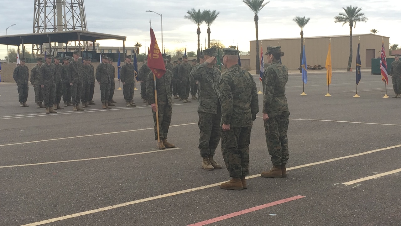 Sgt. Gabriel R. McInnis (center), engineer equipment mechanic with Bulk Fuel Company C, 6th Engineer Support Battalion, 4th Marine Logistics Group, receives a Navy and Marine Corps Achievement Medal at Luke Air Force Base, Ariz., Jan. 7, 2017. McInnis received the medal for his actions in preventing an assault of a family in Tempe, Ariz., Dec. 27, 2016. (Courtesy photo)