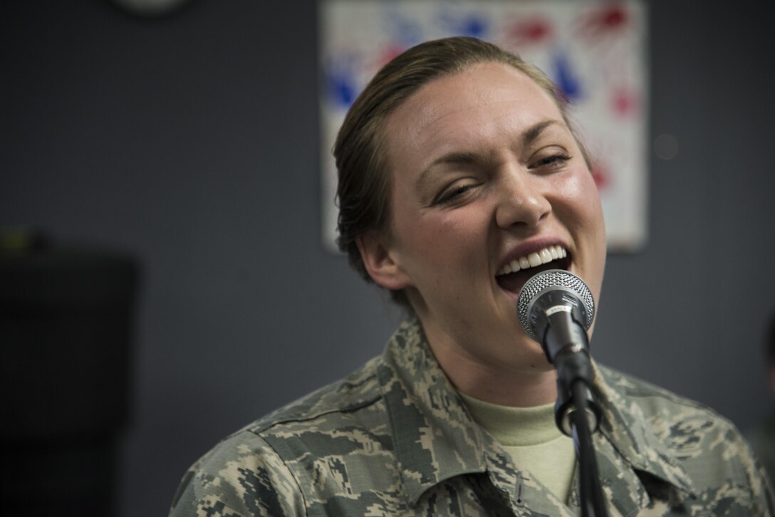 Airman 1st Class Anneke Bentley, Air Force Band of Mid-America Starlifter vocalist, practices in preparation for Scott Air Force bases Centennial Celebration kick off, Jan. 4, 2017 at Scott Air Force Base, Ill. Starlifter is the musical ambassador of the Air Mobility Command. (U.S. Air Force photo by Airman 1st Class Gwendalyn Smith)