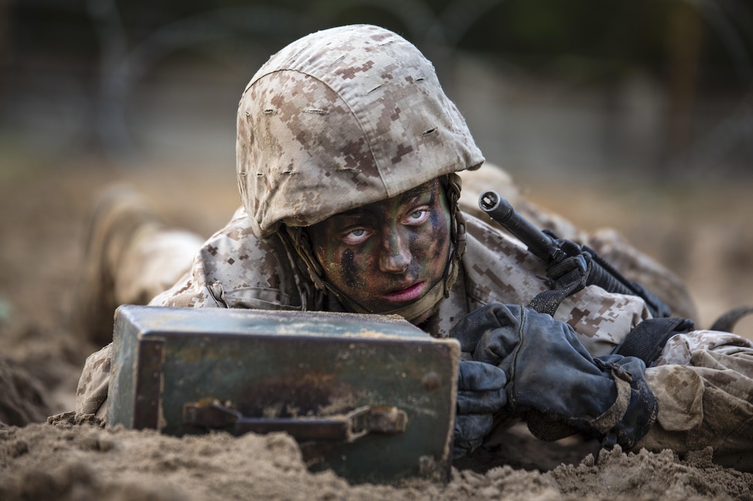 Maria Daume, a Marine Corps recruit, pushes an ammunition can during the Crucible, a 54-hour culminating training event, on Parris Island, Jan. 5, 2017. Daume, assigned to Papa Company, 4th Recruit Training Battalion, was born in a Russian prison and brought to Long Island, N.Y., at the age of 4 when she and her twin brother were adopted. Marine Corps photo by Staff Sgt. Greg Thomas