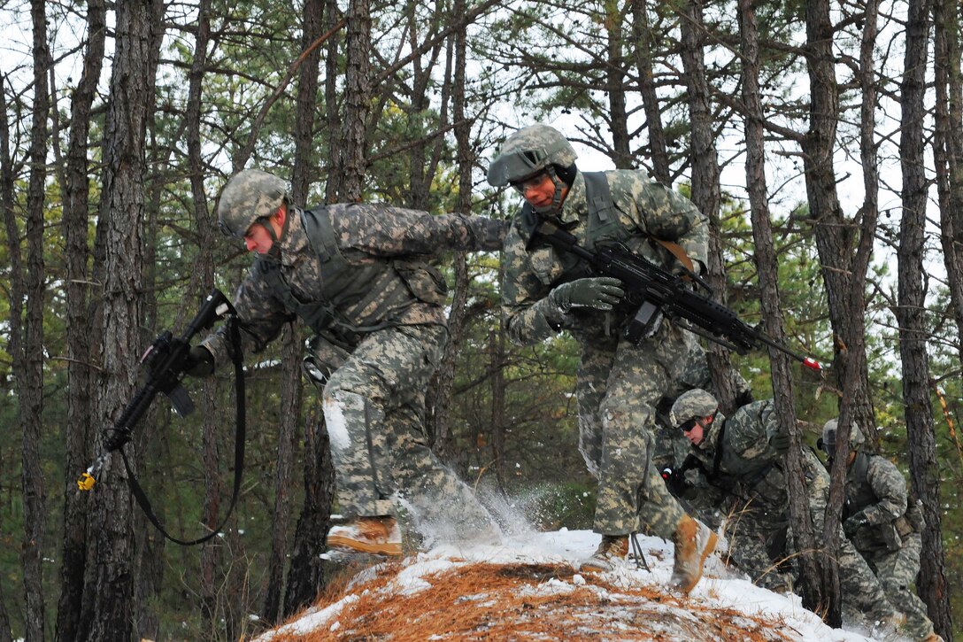 Soldiers assault a building during a training exercise at Joint Base McGuire-Dix-Lakehurst, N.J., Jan. 9, 2017. The soldiers, assigned to the New Jersey Army National Guard, are participating in training events that will culminate in an eXportable Combat Training Capability exercise at Fort Pickett, Va. New Jersey Army National Guard photo by Sgt. 1st Class Wayne Woolley