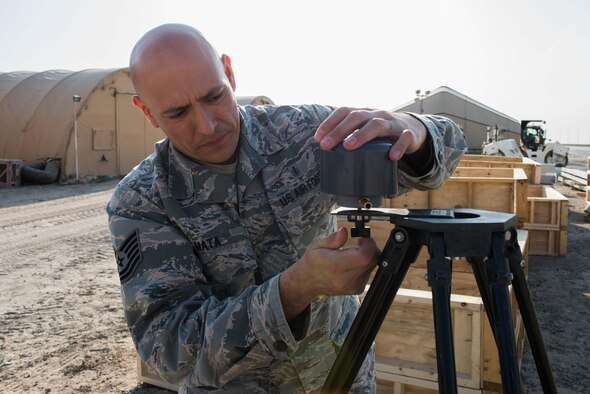 U.S. Air Force Tech. Sgt. Tomas Mata and Staff Sgt. Anthony LaCombe, 332nd Expeditionary Medical Group bioenvironmental engineering specialists, perform a work site assessment at a Marine Corps vehicle maintenance garage at the 407th Air Expeditionary Group, Jan. 5, 2016. The bioenvironmental specialists perform work site safety inspections for physical health hazards to ensure service members are safe. (U.S. Air Force photo by Staff Sgt. R. Alex Durbin)