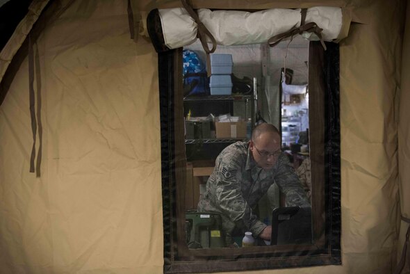 U.S. Air Force Tech. Sgt. Tomas Mata and Staff Sgt. Anthony LaCombe, 332nd Expeditionary Medical Group bioenvironmental engineering specialists, perform a work site assessment at a Marine Corps vehicle maintenance garage at the 407th Air Expeditionary Group, Jan. 5, 2016. The bioenvironmental specialists perform work site safety inspections for physical health hazards to ensure service members are safe. (U.S. Air Force photo by Staff Sgt. R. Alex Durbin)