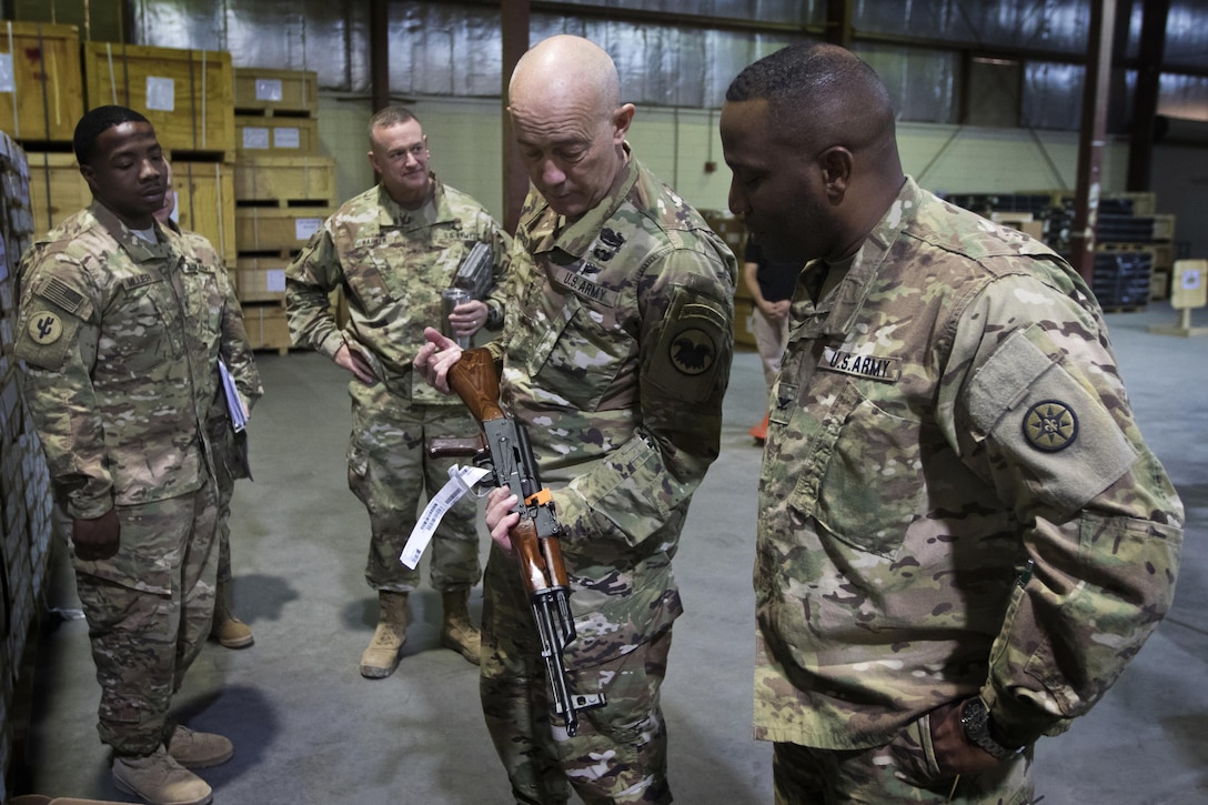 U.S. Army Reserve Commanding General, LTG Charles D. Luckey, inspects an AK-47 rifle during a tour of the Iraq Train and Equipment Fund (ITEF) warehouse at Camp Arifjan, Kuwait, Jan. 4, 2017. 
