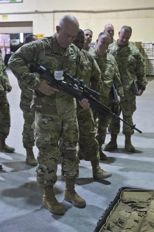 U.S. Army Reserve Commanding General, LTG Charles D. Luckey, comments on the M14 Enhanced Battle Rifle during a tour of the Iraq Train and Equipment Fund (ITEF) warehouse at Camp Arifjan, Kuwait, Jan. 4, 2017. (U.S. Army Photo by Staff Sgt. Dalton Smith)