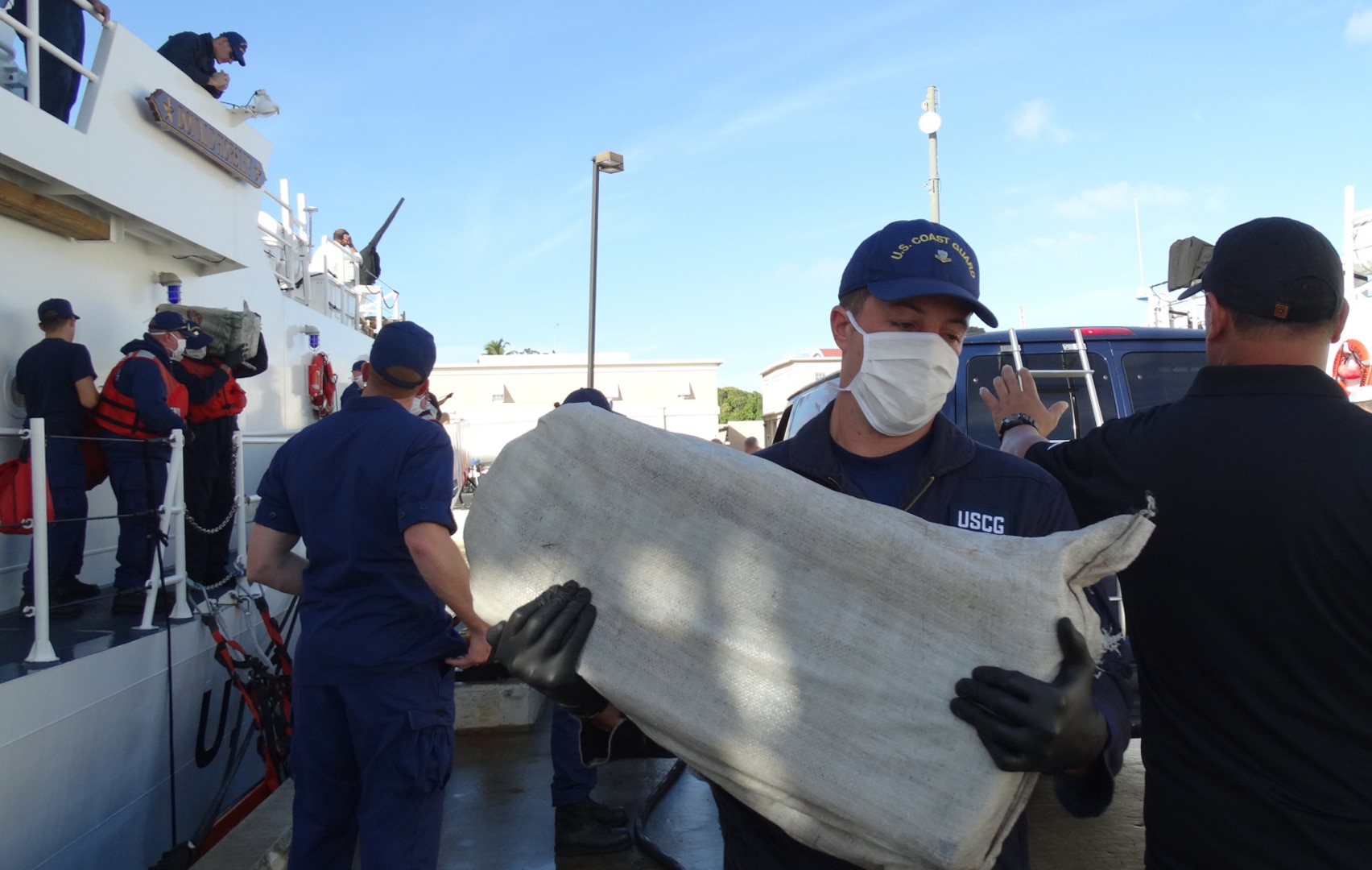 The Coast Guard transferred custody of four suspected smugglers and multiple bales of cocaine to U.S. federal law enforcement authorities at Coast Guard Sector San Juan, Puerto Rico Jan. 8, 2017. In total, 2,000 pounds of cocaine with an estimated wholesale value of $30 million were seized as a result of multi-agency law enforcement efforts in support of Operation Unified Resolve and Operation Caribbean Guard. (U.S. Coast Guard photo)
